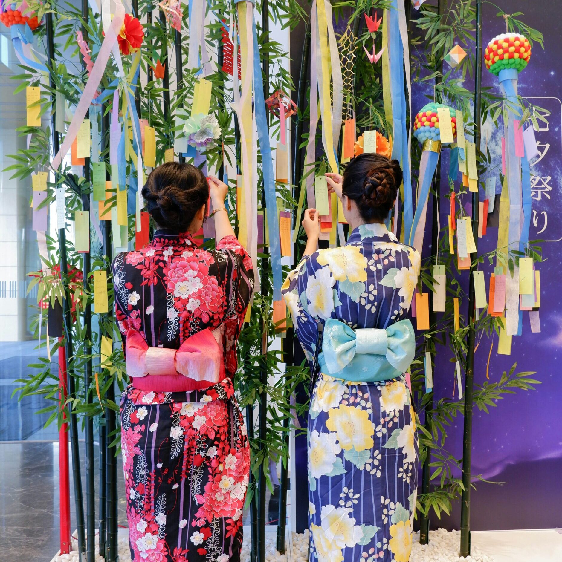 a couple of women standing next to each other